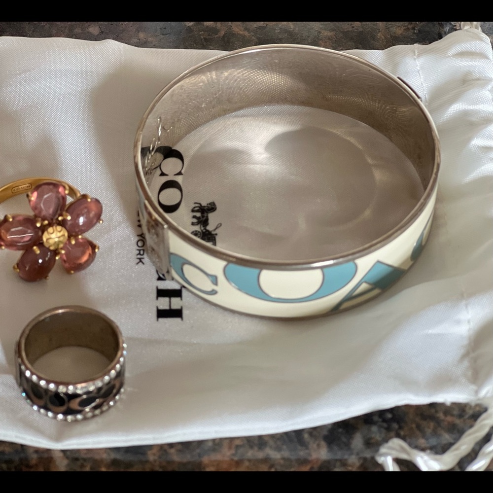Coach bangle bracelet and two Coach rings.